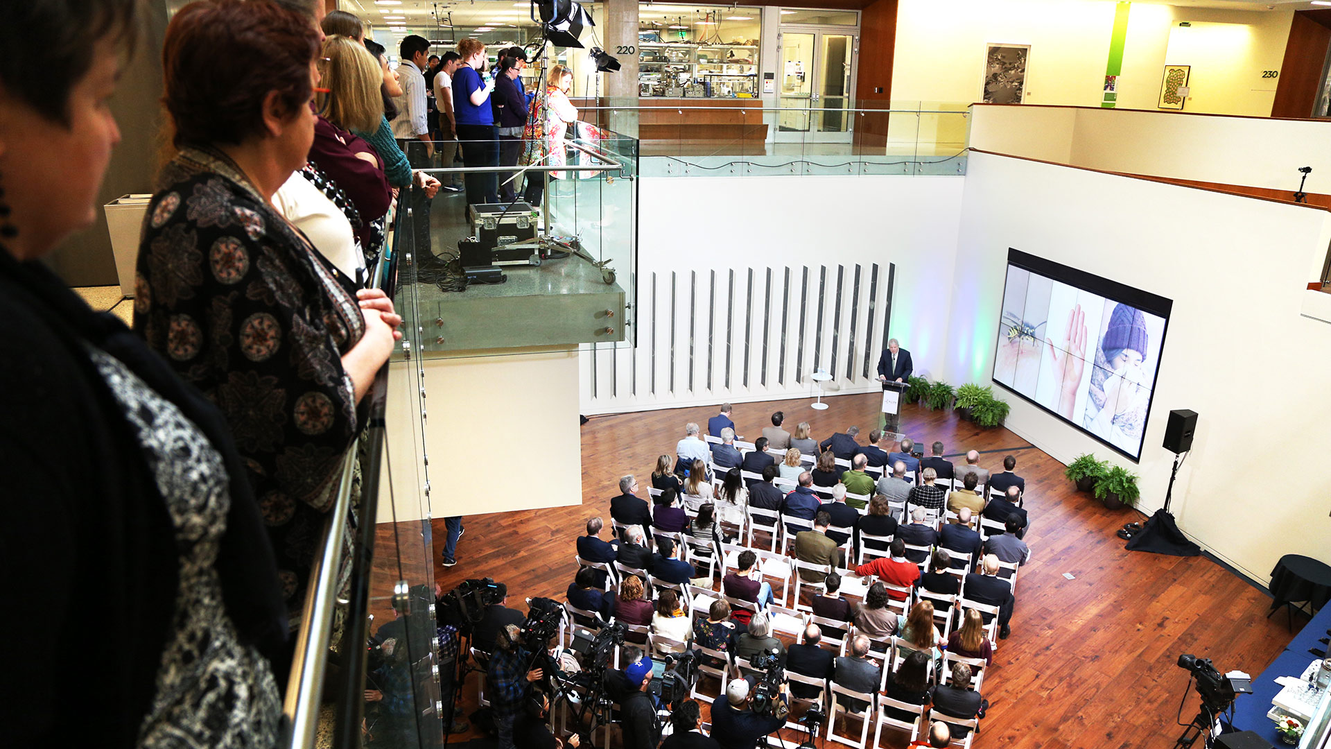 Crowds of people watching a press conference of Immunology Institute launch