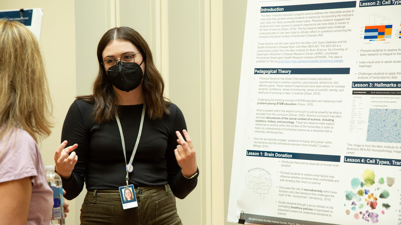 Madison Meuler, an intern in the education team of the Communications department, presents her poster on how she created a lesson plan around the Allen Institute’s open-source data. Photo by Jenny Burns / Allen Institute