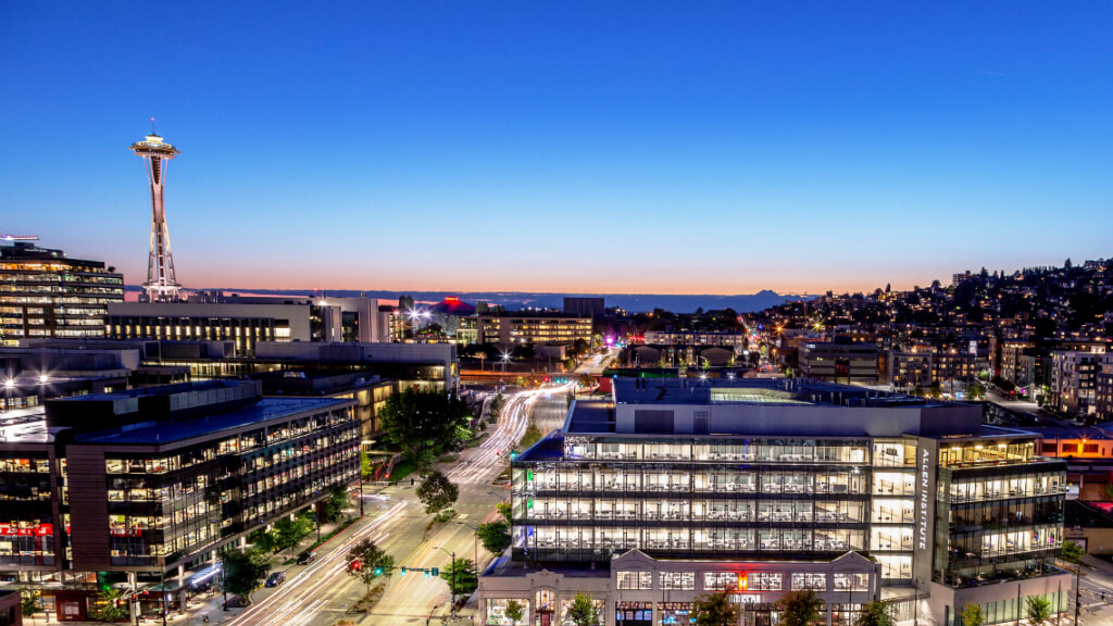 The Allen Institute headquarters (lower right) illuminated in the South Lake Union neighborhood of Seattle, WA.