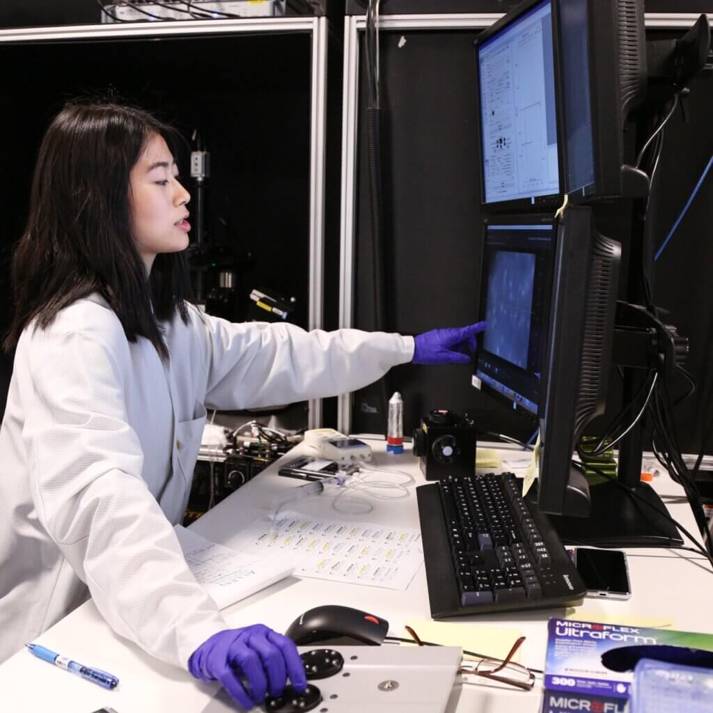 Researcher in the ephys lab recording electrical properties of live brain cells
