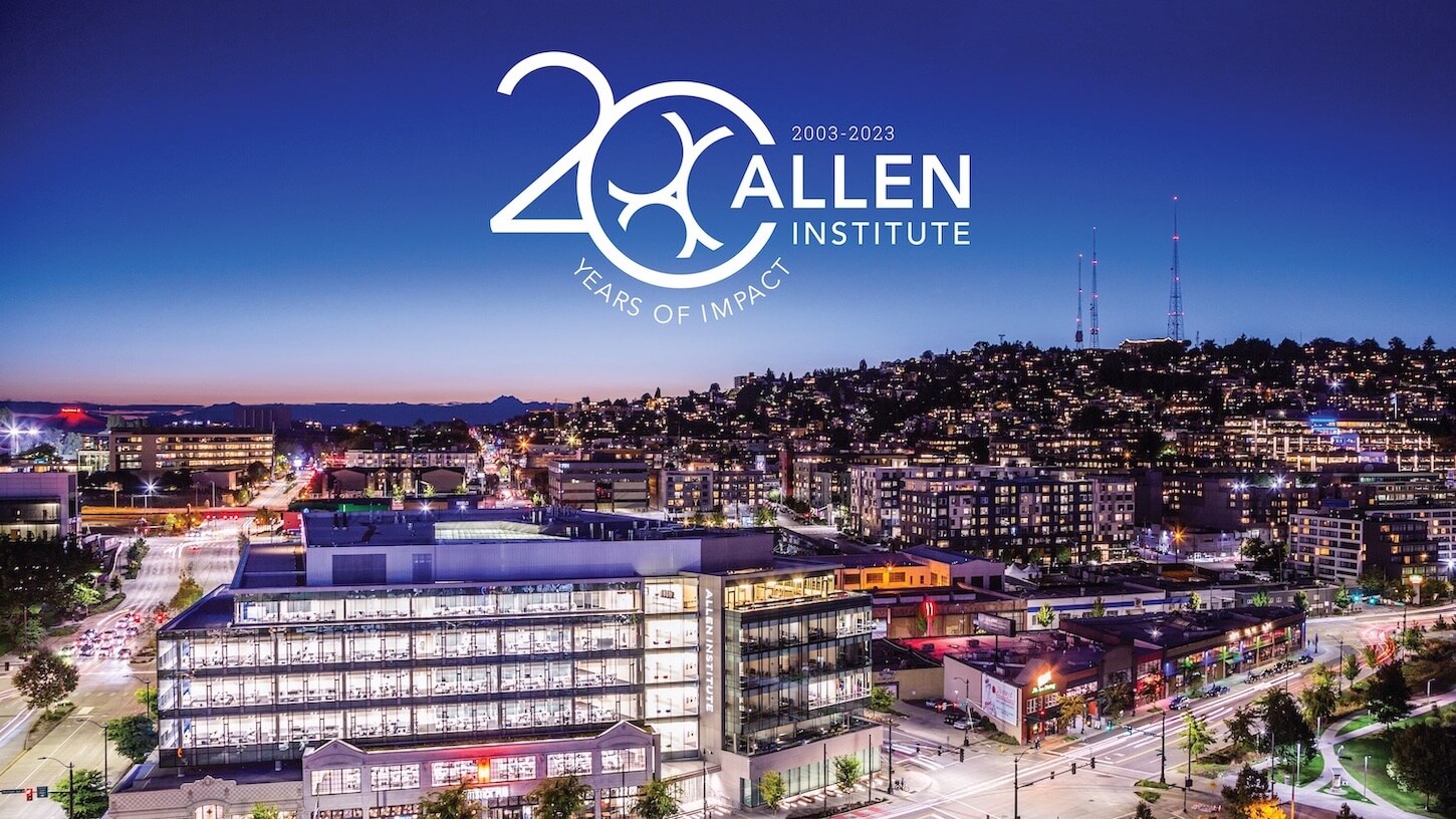 Beautiful editorial photo of the Allen Institute Headquarters with an overlay of the Allen Institute 20th Anniversary Logo