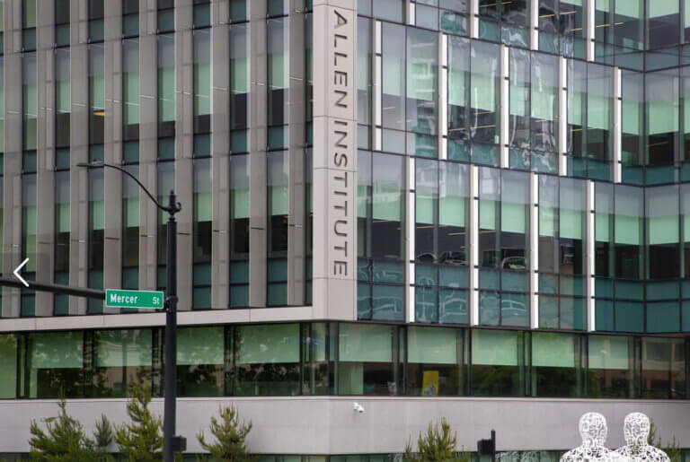 Building exterior with a vertical sign reading Allen Institute