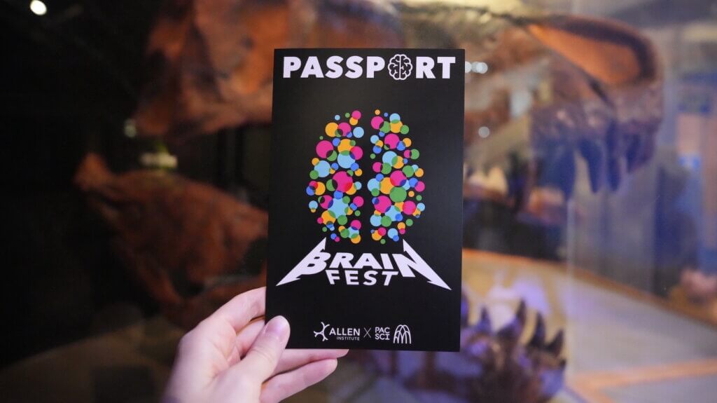 Hand holding up an event passport.