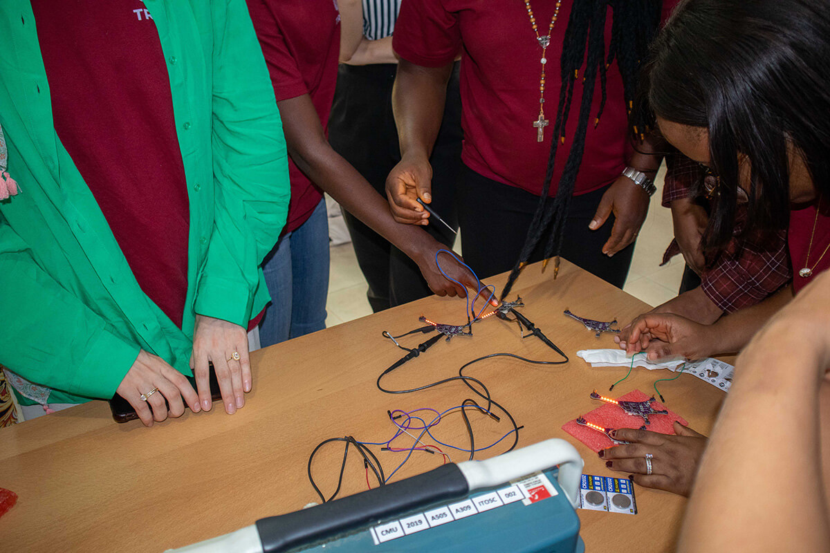 students work with a circuit board