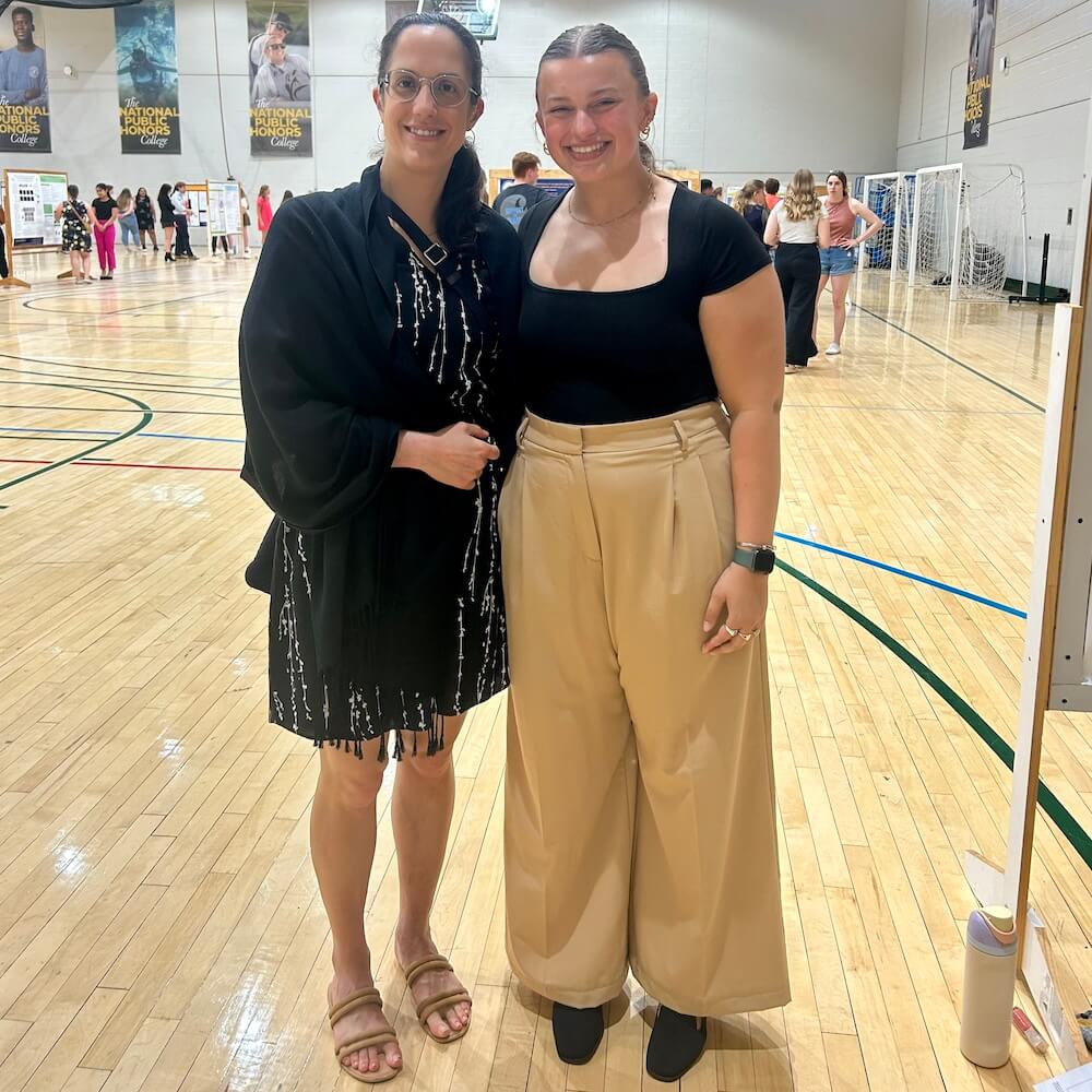 Sarah Latchney (left) and Julia Milner at St. Mary’s College after Milner presented her senior capstone project. 