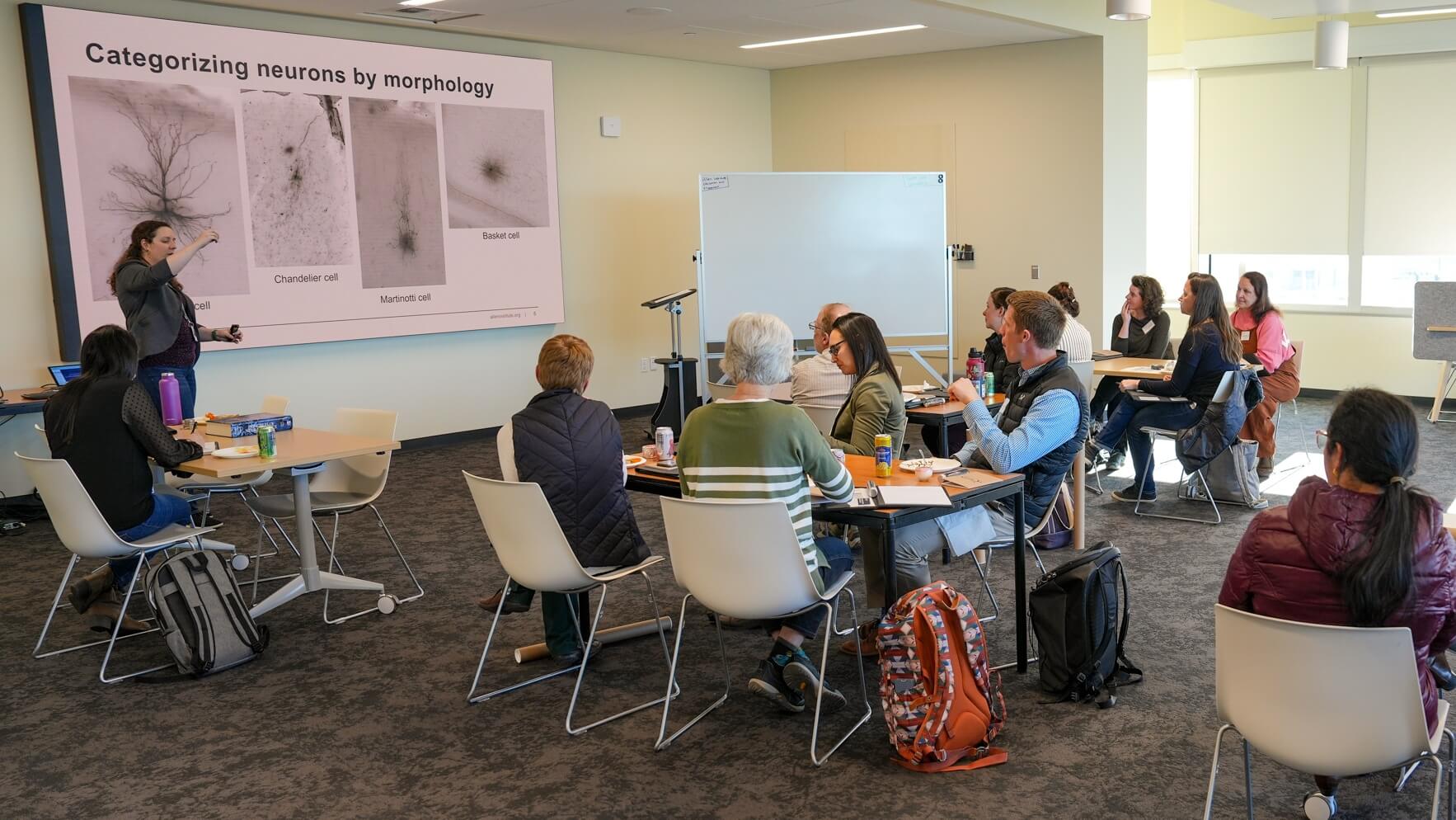 Educators in a classroom watching a presentation