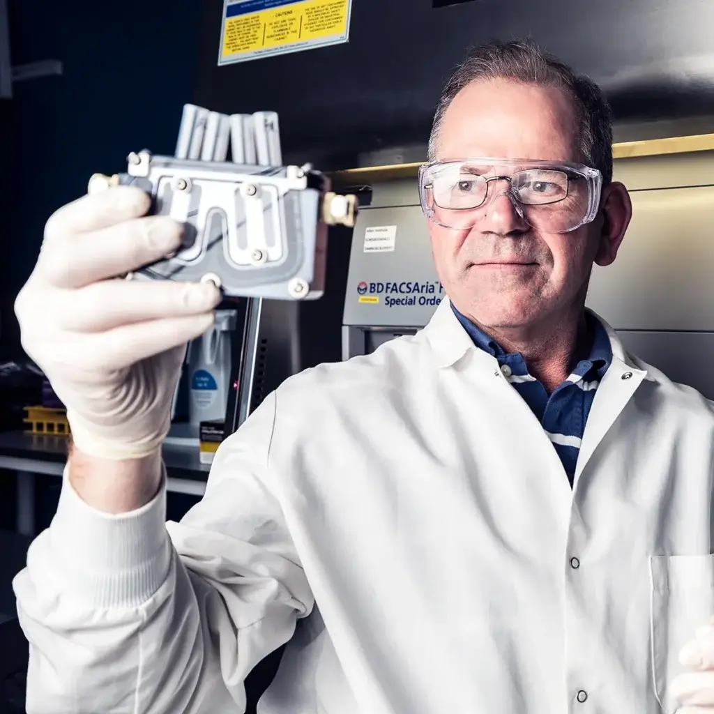 Male scientist in lab with equipment