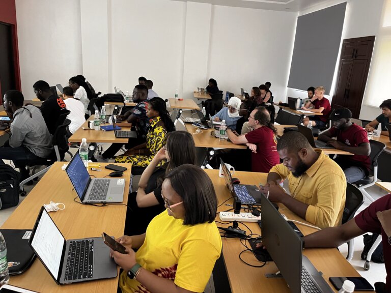 Students in Africa working at desks in a classroom