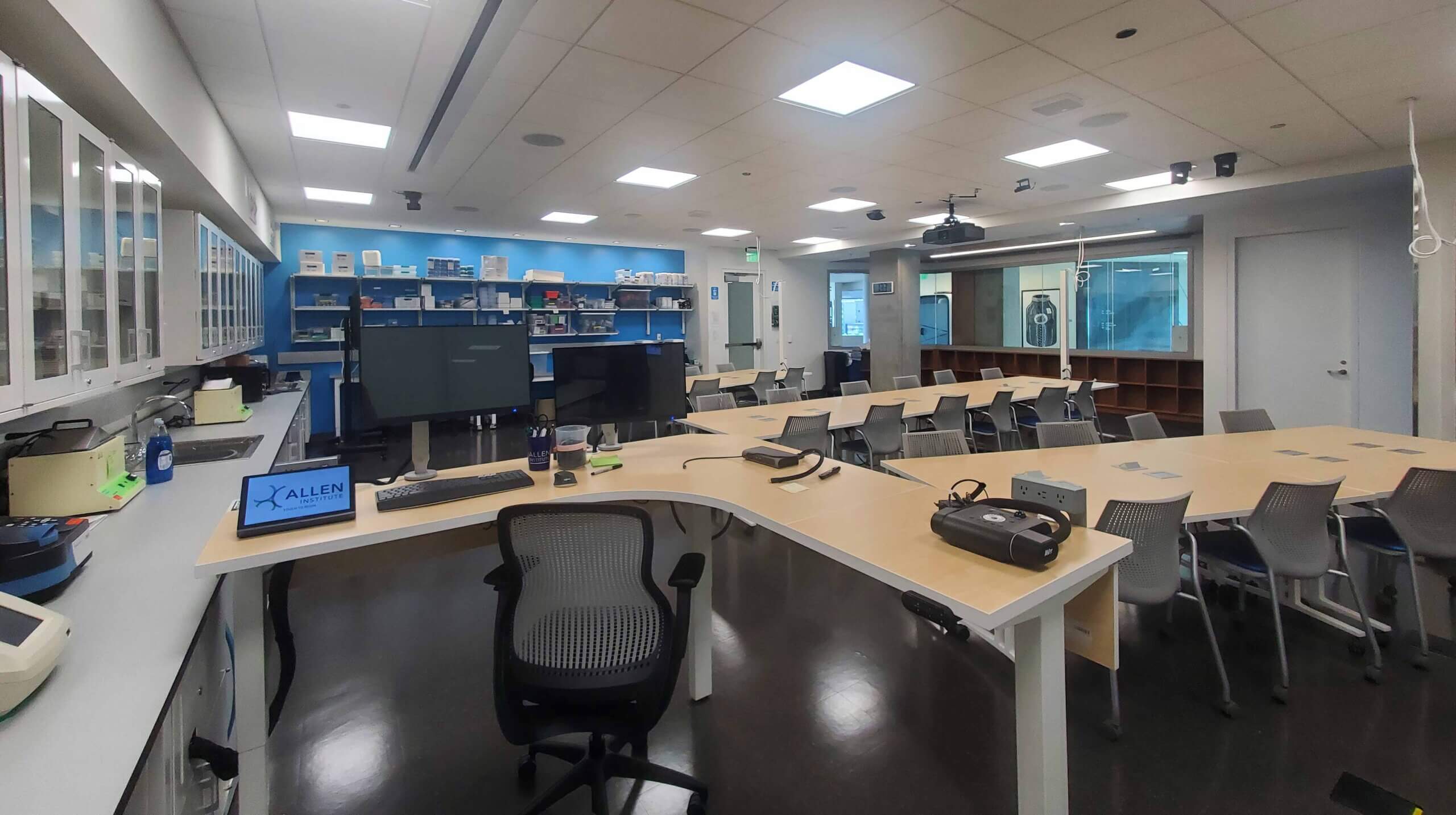 http://Scientific%20laboratory%20with%20tables,%20chairs,%20and%20microscopes