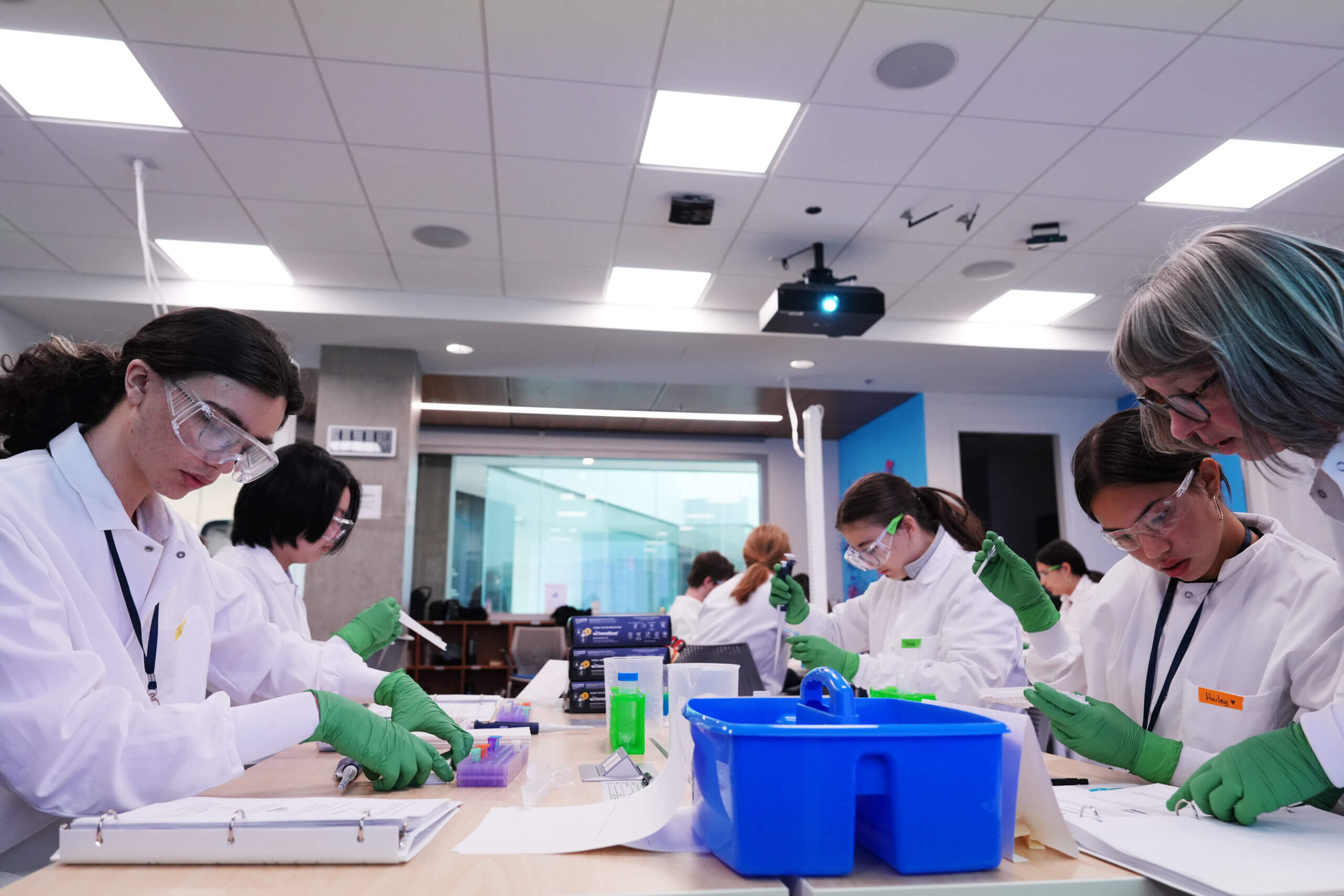 Students in the education lab pipetting samples