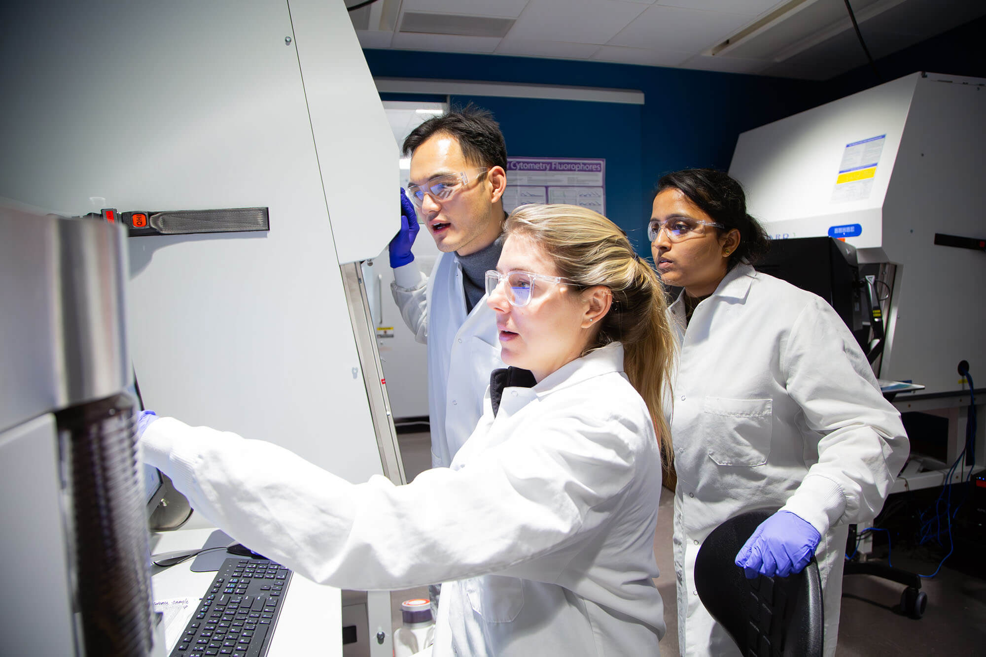 3 scientists discussing research